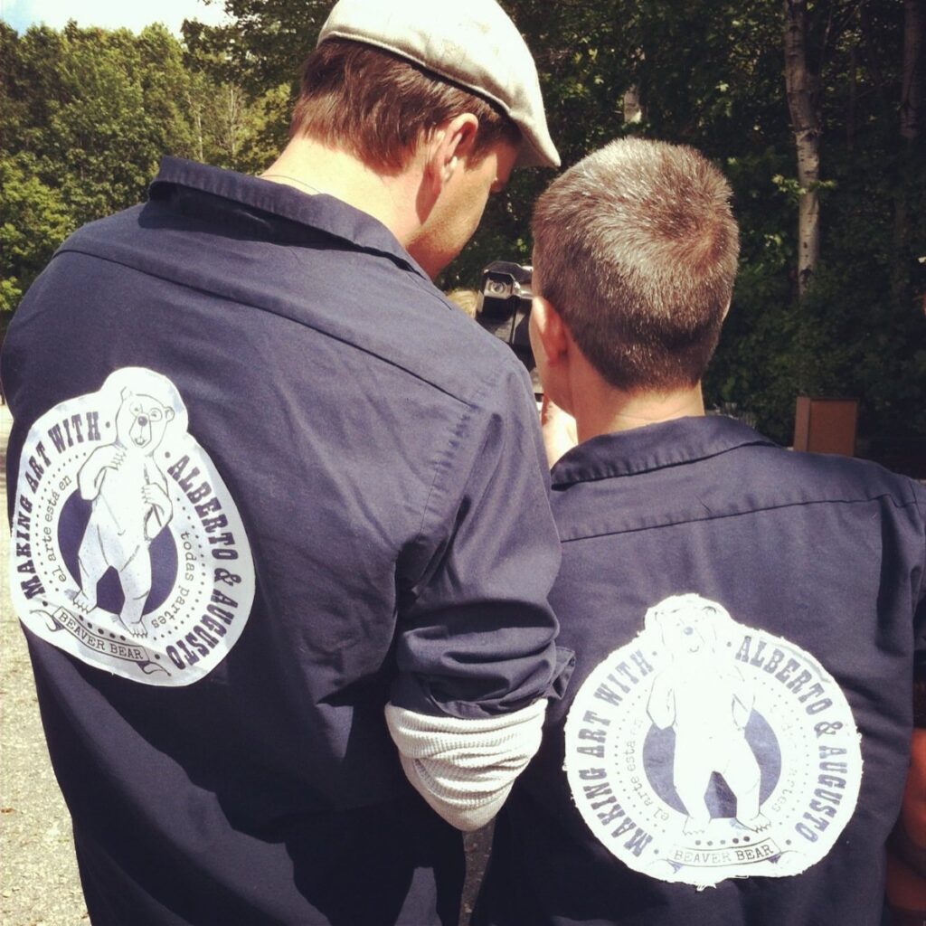 Brenden Sanborn and his friend Kelly Jo Shows in matching Alberto and Augusto shirts at a flea market in Maine