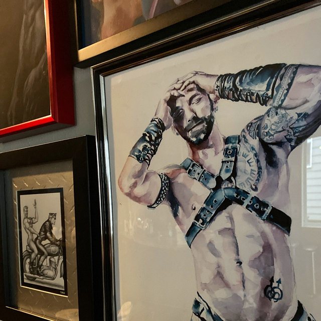 Framed art print by Brenden Sanborn of a bearded man in a leather harness, hanging on a wall