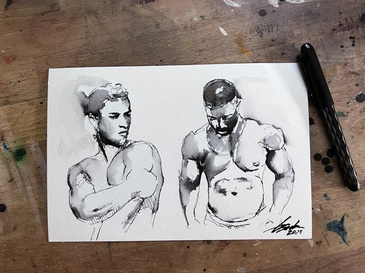 Two morning ink figure sketches by Brenden Sanborn side by side on his studio table