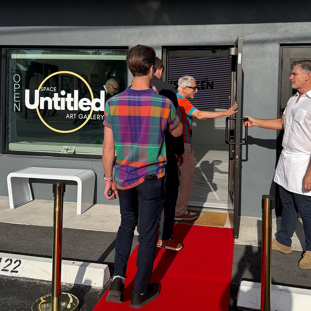 Guests arriving on the red carpet at Space Untitled Art Gallery in Wilton Manors for the opening night of Unspoken
