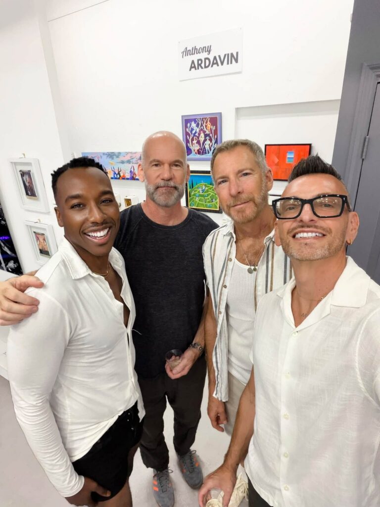 Brenden Sanborn with friends in front of Anthony Ardavin's wall at The Collector's Secret opening