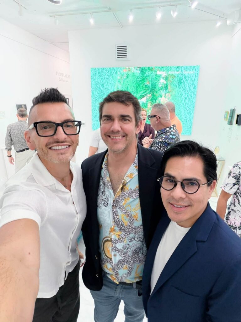 Brenden Sanborn with guests at The Collector's Secret opening night at Space Untitled Art Gallery