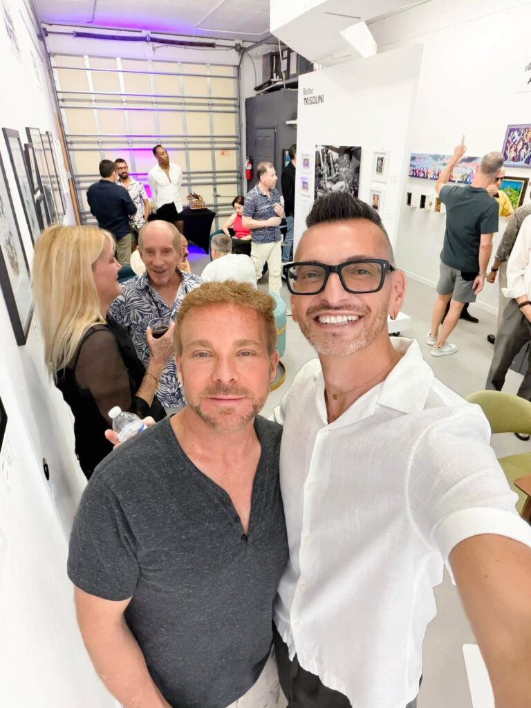 Brenden Sanborn with guests in a busy gallery on The Collector's Secret opening night